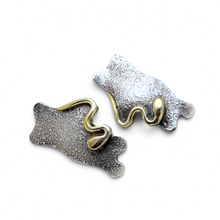 925Collection abstract stud earrings featuring textured matte silver and polished gold-tone accents.