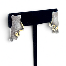 925Collection abstract stud earrings featuring textured matte sterling silver and polished gold-tone accents.