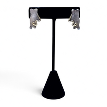 925Collection abstract stud earrings featuring textured matte silver and polished gold-tone accents on a display stand.