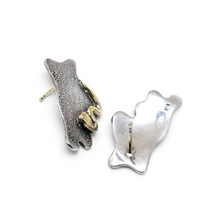 925Collection abstract stud earrings featuring textured matte silver and polished gold-tone accents.
