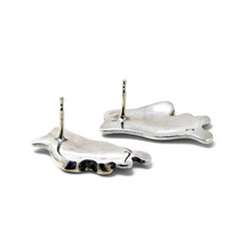 925Collection abstract stud earrings showing the smooth silver back and post-back closure on a neutral surface.