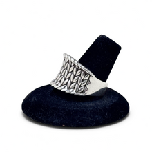 925Collection JAI sterling silver wide band ring featuring an intricate woven texture on a black display stand