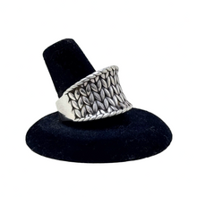 925Collection JAI sterling silver wide band ring featuring an intricate woven texture on a black display stand