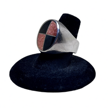 925Collection sterling silver signet ring featuring an oval face with a black stone and gold glitter quadrant inlay.
