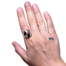 925Collection sterling silver signet ring with a geometric black and gold glitter quadrant inlay on a hand