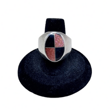 925Collection sterling silver signet ring featuring a geometric oval inlay with black stone and gold glitter quadrants.