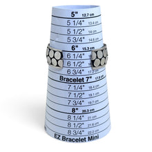 925Collection sterling silver wide cuff bracelet with a double row of circular discs on an oxidized background