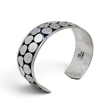 925Collection sterling silver wide cuff bracelet featuring a double row of polished circular discs on oxidized metal.