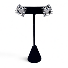 925Collection sterling silver heart stud earrings with intricate filigree and floral detailing on a black display stand