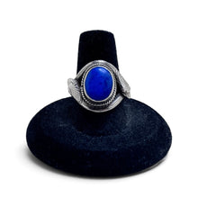 925Collection sterling silver statement ring featuring an oval-cut blue lapis lazuli stone with a textured snake motif.