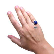 925Collection sterling silver ring with an oval lapis lazuli stone and bead accents worn on a hand
