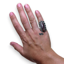 925Collection sterling silver statement ring featuring an elongated oval stone with rope detailing on a hand.