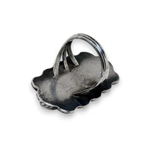 925Collection sterling silver statement ring showing the back view with split-shank band and scalloped silver edges.
