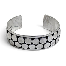 925Collection sterling silver wide cuff bracelet featuring a double row of polished circular discs on oxidized metal.