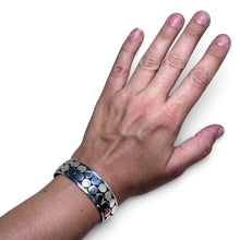 925Collection sterling silver wide cuff bracelet with a double row of polished circular discs on an oxidized background