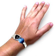 925Collection Taxco sterling silver cuff bracelet featuring a domed black enamel heart on a model's wrist