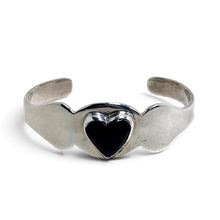 925Collection vintage Taxco sterling silver cuff bracelet featuring a domed black enamel heart in a bezel setting.