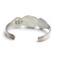 925Collection vintage Taxco sterling silver cuff bracelet back view showing hallmark stamps on the metal surface
