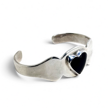 925Collection vintage Taxco sterling silver cuff bracelet featuring a domed black enamel heart in a bezel setting.