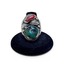 925Collection sterling silver statement ring featuring a natural turquoise stone, red coral accent, and leaf motifs.