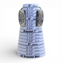 EZ Bracelet Mini measuring tool with silver decorative ends on a white background